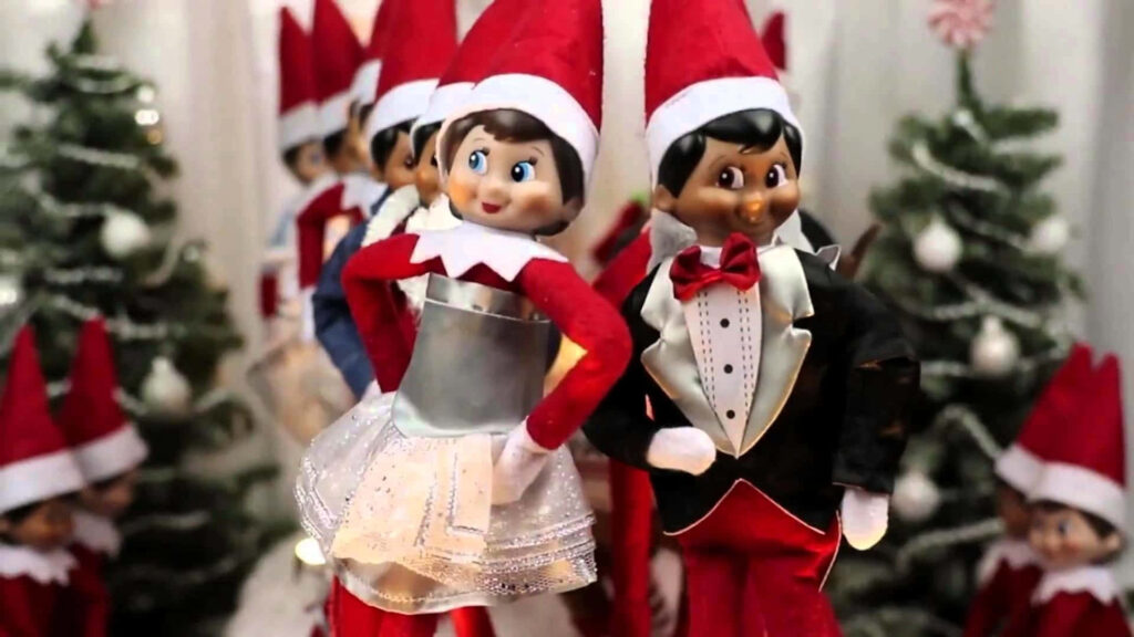 Cheerful Christmas Elves amidst Festive Trees - Holiday Wallpaper