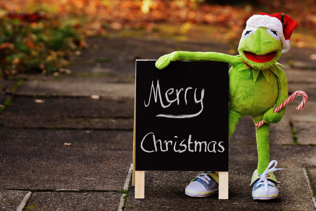 Cheerful Puppet Santa Wallpaper: Merry Christmas Outdoor Scene