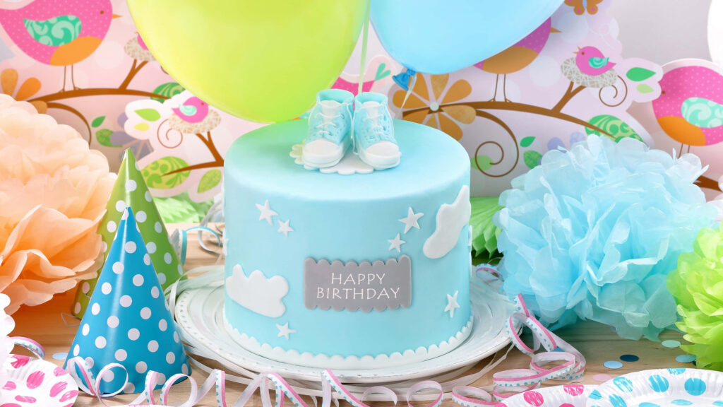 Cheerful Pastel Blue Birthday Cake Wallpaper with Balloons & Booties