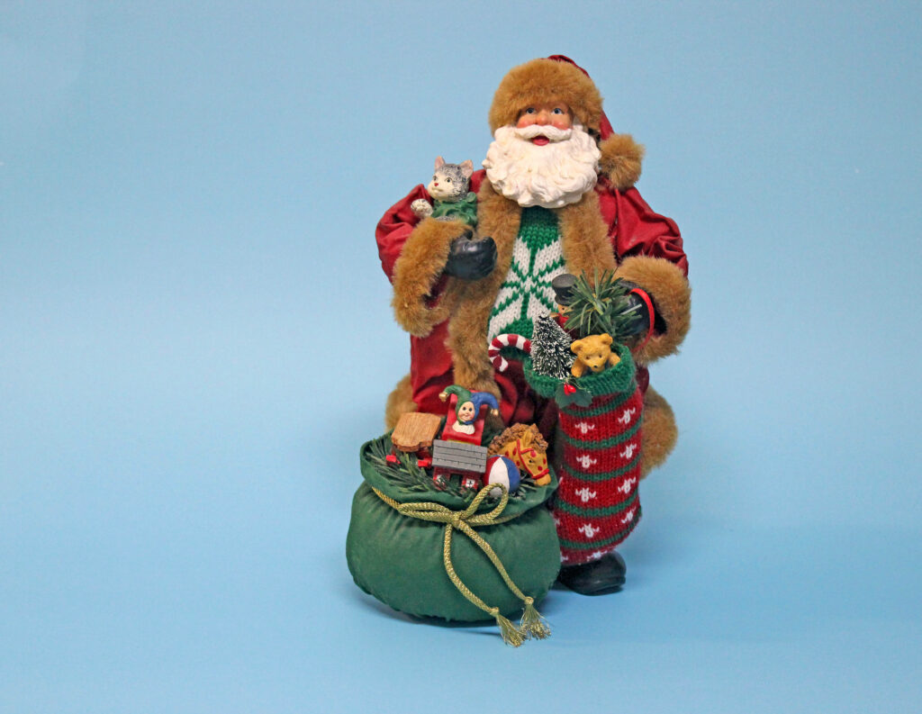 Cheerful Santa Claus Figurine Wallpaper for Joyful Christmas Spirit