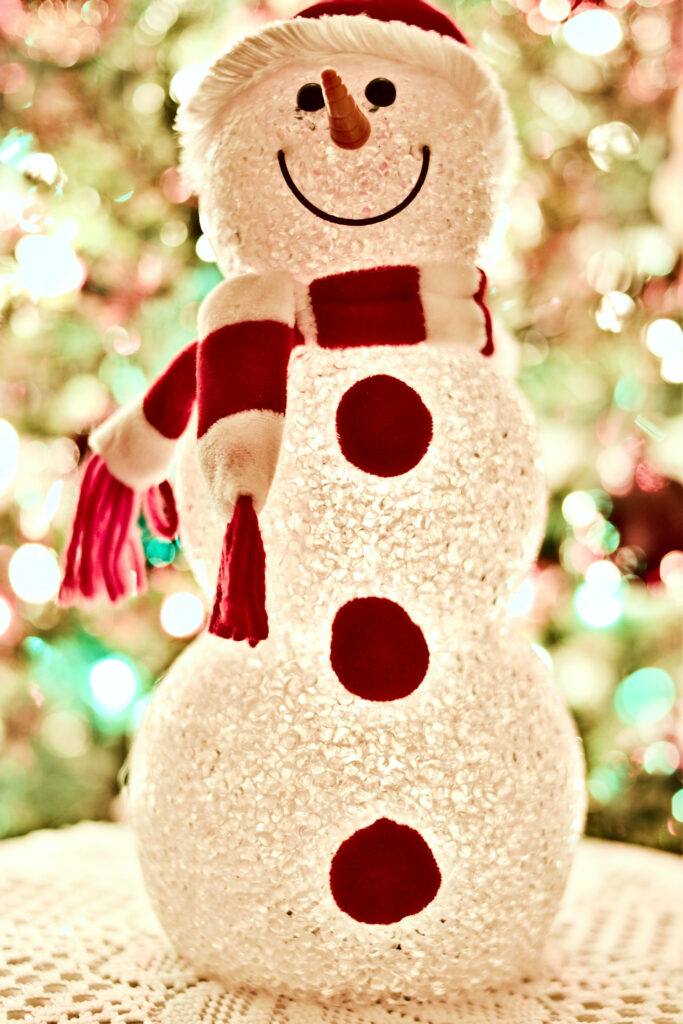 Sparkling Snowman Wallpaper: Festive Red Scarf & Lights Background