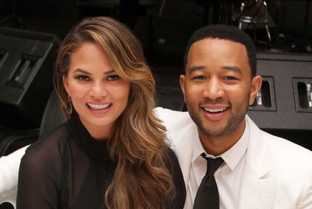 Cheerful Wallpaper of Chrissy Teigen & Partner - Elegant & Happy Background