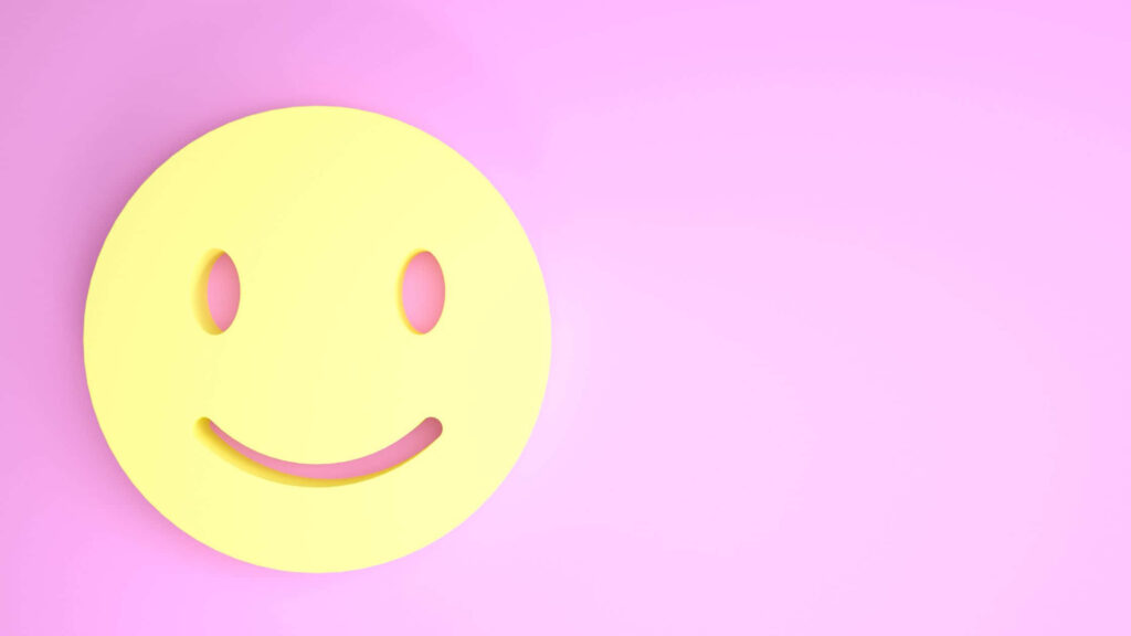Cheerful Yellow Icon Brings Joy to Pink Wallpaper Background