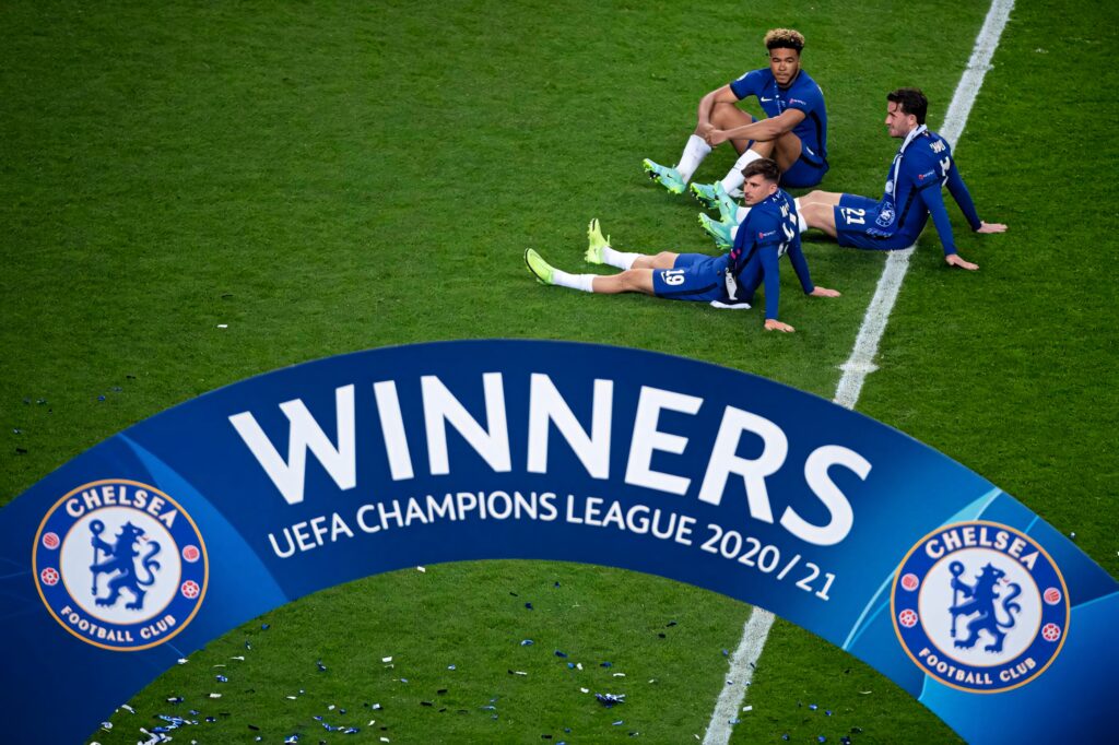 Mason Mount Reece James Ben Chilwell celebrate Chelsea Champions League win on pitch blue kits Wallpaper