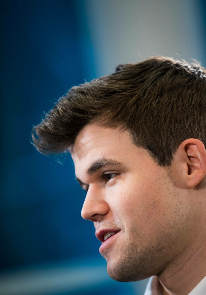 Intense Magnus Carlsen: Focused Side Profile for Chess Wallpaper