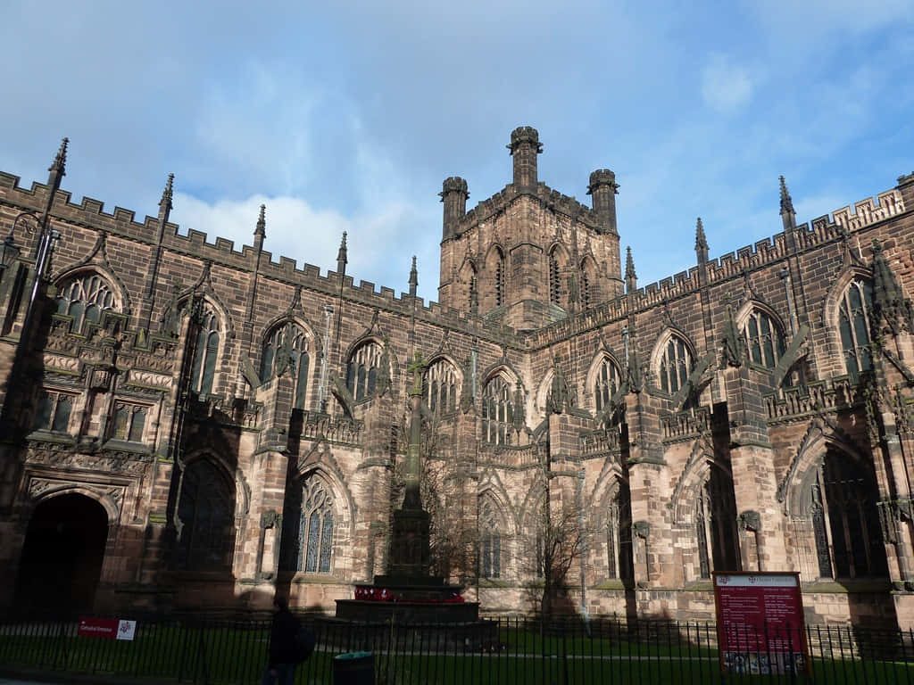 Chester Cathedral Gothic architecture red sandstone walls historic English church blue sky Wallpaper