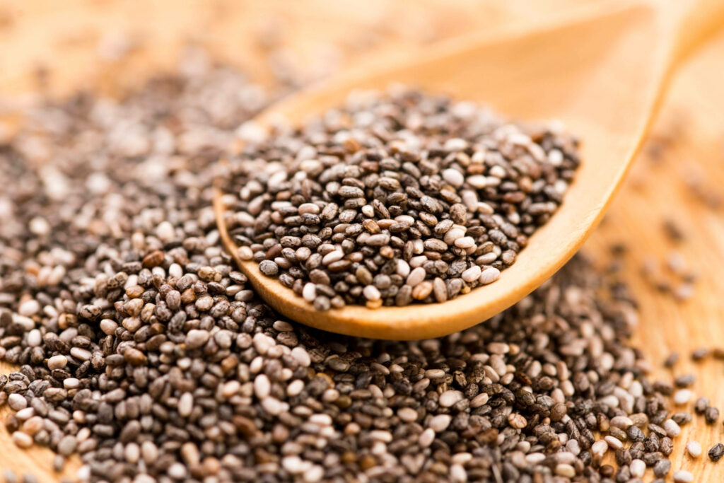 Close-Up of Chia Seeds on Wooden Spoon - Natural Texture Wallpaper