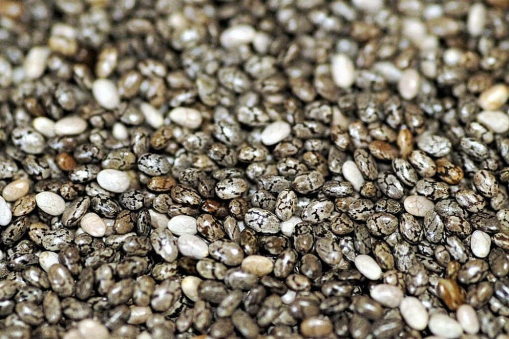Chia Seeds Close-Up: Unique Textures & Earthy Tones Wallpaper