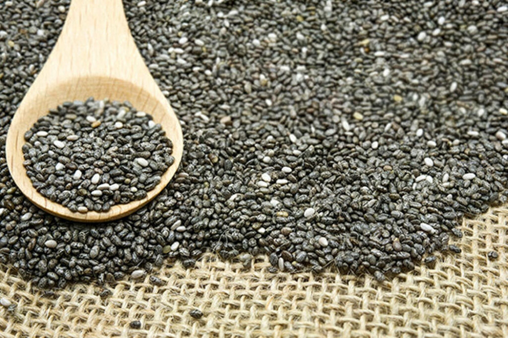 Chia Seeds Close-Up on Burlap with Wooden Spoon - Natural Texture Wallpaper