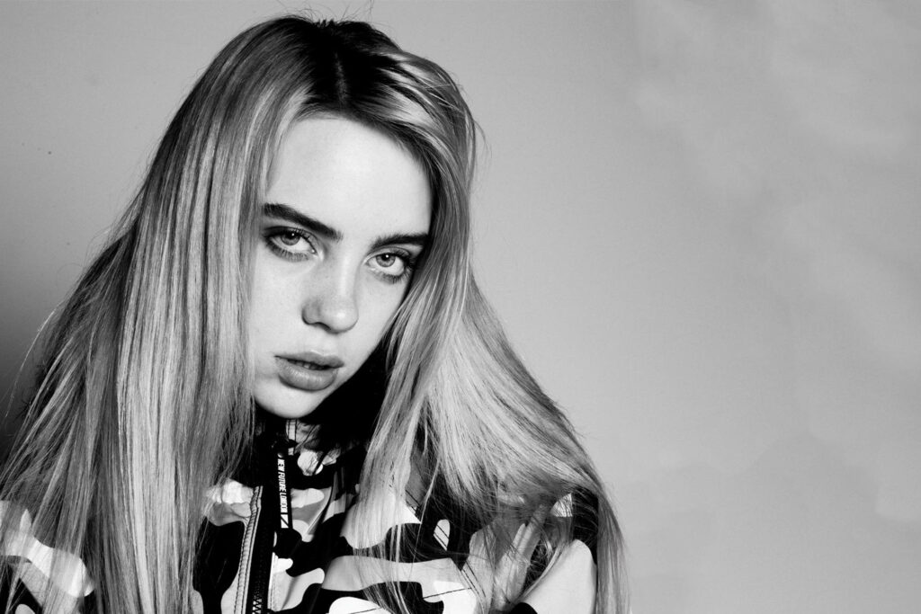 Monochrome Majesty: Bleached Blonde Billie Eilish Radiates Edgy Chicness in 4k Army Attire Wallpaper