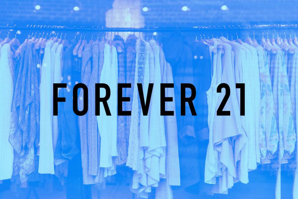 Chic Forever 21 fashion wallpaper with light apparel rack and modern blue overlay background
