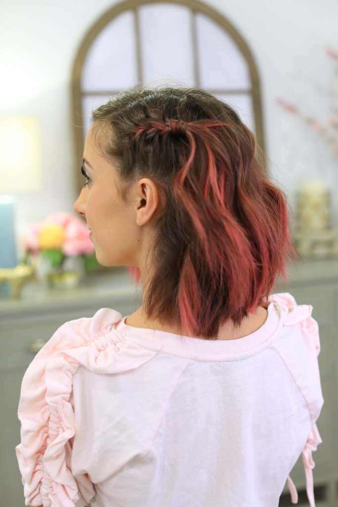 Bailey McKnight hairstyle with shoulder-length brown hair pink highlights delicate side braid indoors Wallpaper