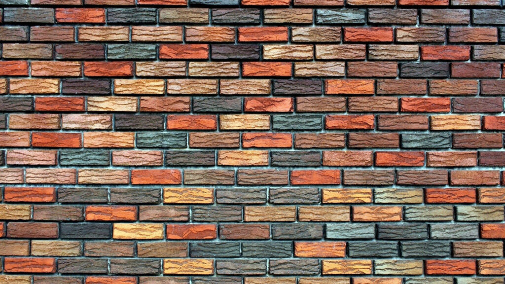 Vibrant Strokes: A Smooth and Colorful Brick Wallpaper