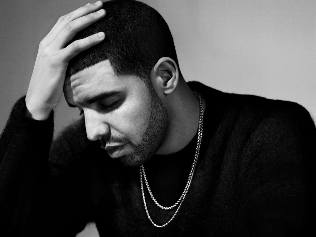 Chilling in Chains: Greyscale Drake Rocks a Cozy Sweater in Epic Wallpaper