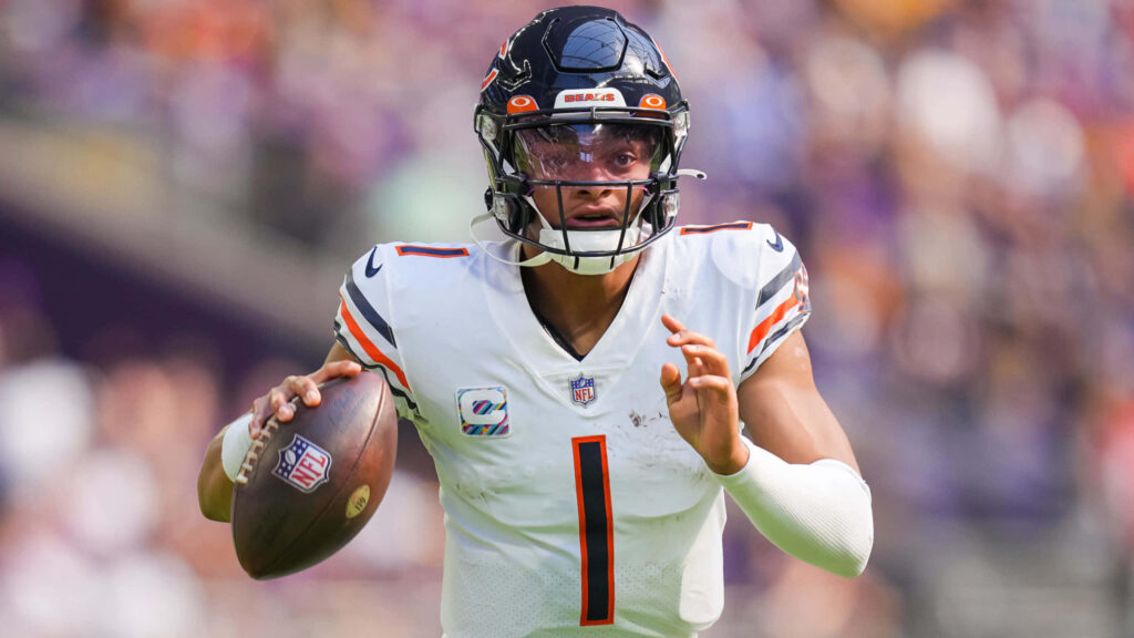 Chicago Bears quarterback in action ready to throw football vibrant team colors wallpaper