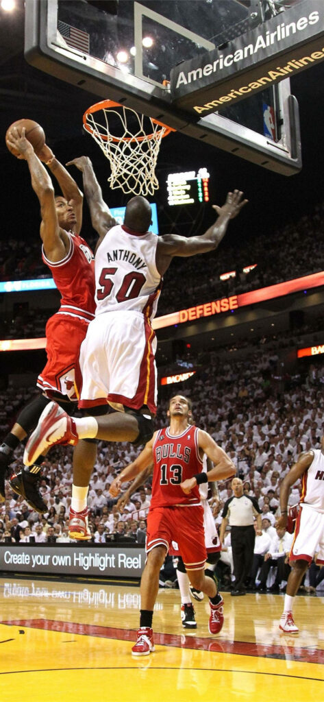 Chicago Bulls player drives to hoop defended by Cole Anthony and Dwight Howard NBA action wallpaper