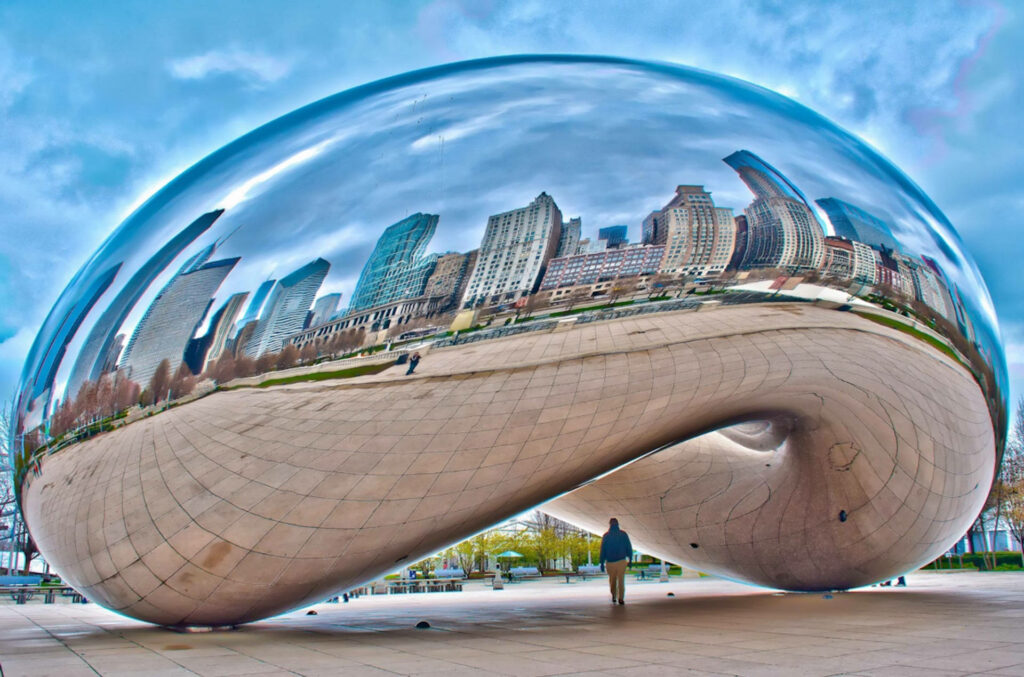 The Bean Chicago reflecting city skyline under bright sky modern urban Cloud Gate artwork wallpaper
