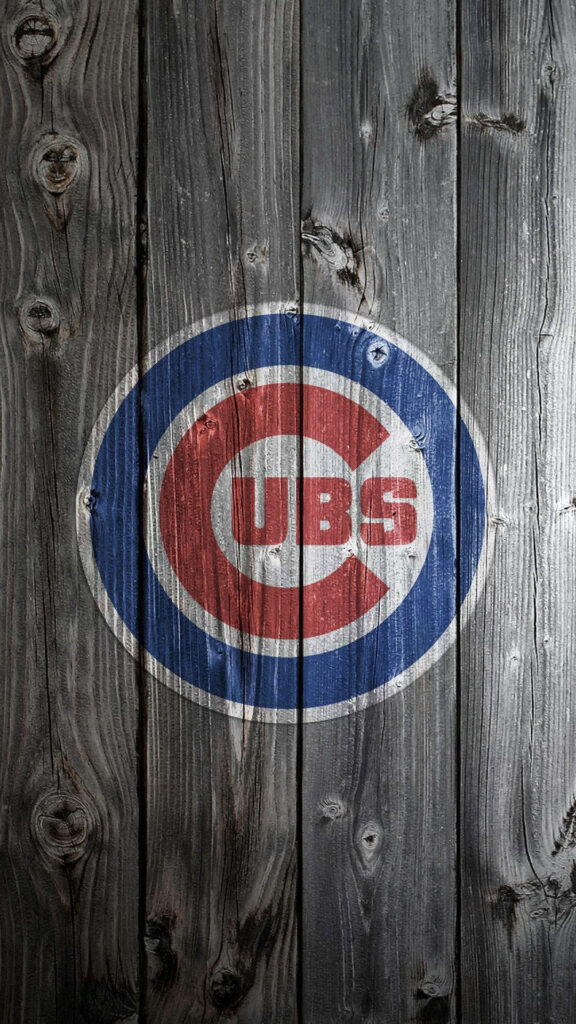 Chicago Cubs logo on rustic wooden planks textured sports wallpaper with blue and red colors