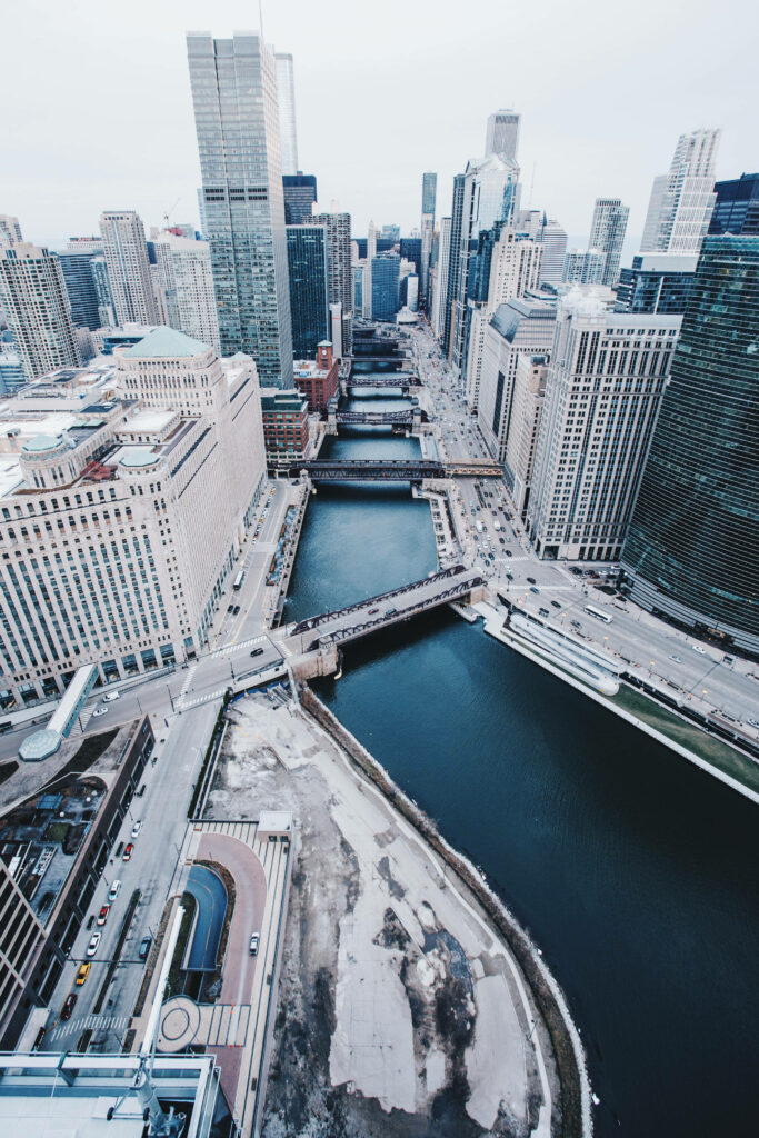 Chicago skyline bird’s eye view with skyscrapers river and bridges in cool blue tones wallpaper