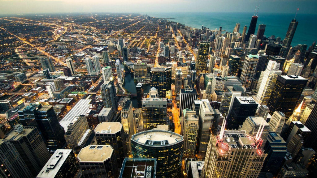 Chicago Skyline: An Awe-Inspiring Aerial Odyssey Over the Urban Majesty Wallpaper