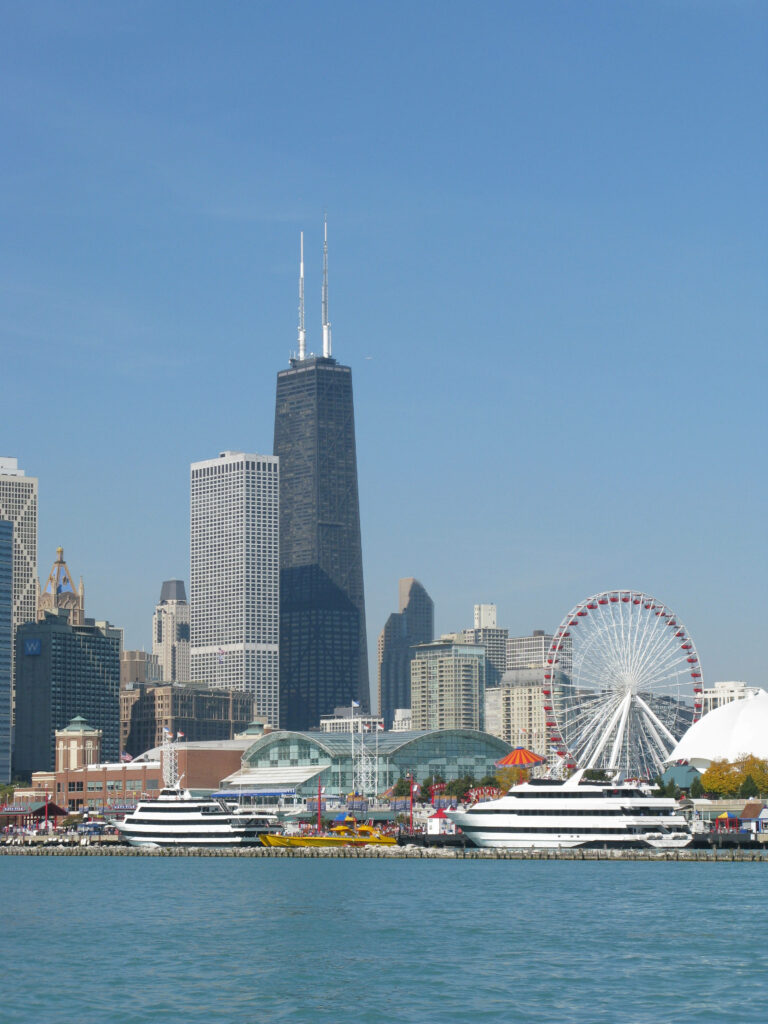 Chicago skyline wallpaper with Navy Pier Ferris wheel skyscrapers and calm blue waterfront