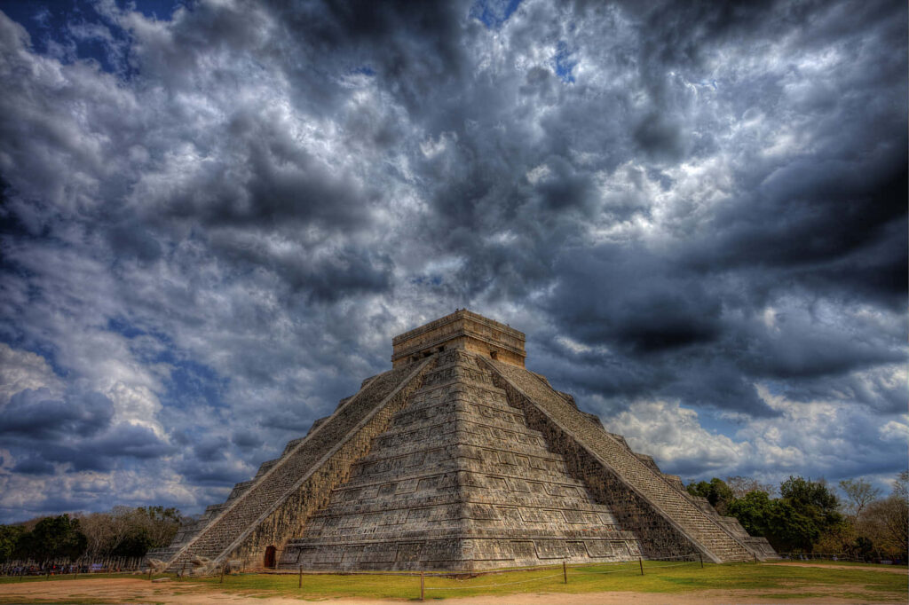 Stunning Chichen Itza Wallpaper: Pyramid Amid Dramatic Dark Clouds