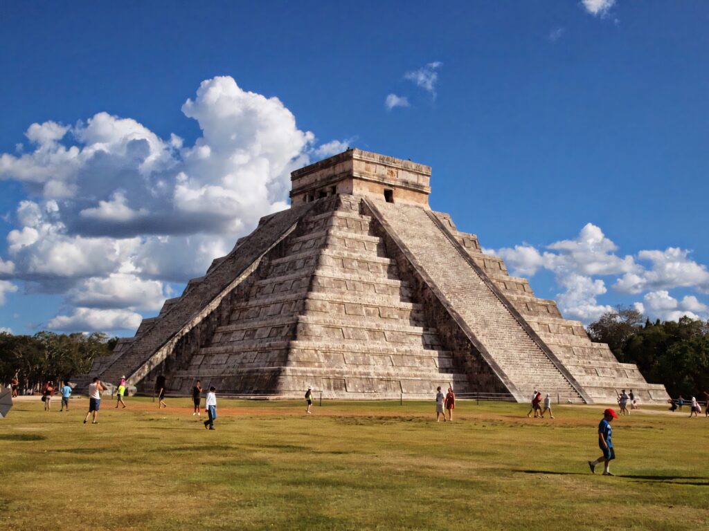 Chichen Itza Pyramid Wallpaper: Iconic Temple Against Blue Sky