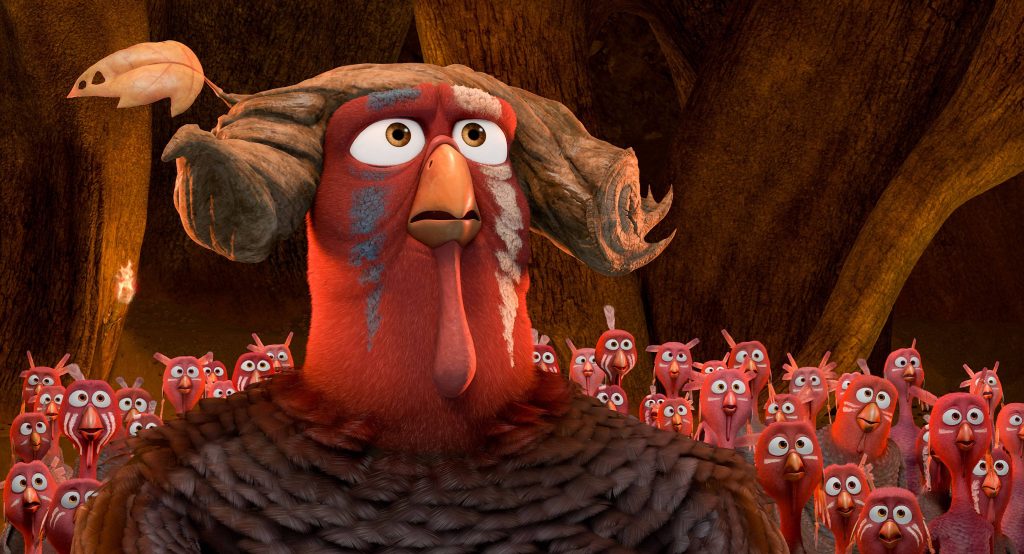 Chief Broadbeak turkey leader with wooden horns and face paint in cave Free Birds wallpaper