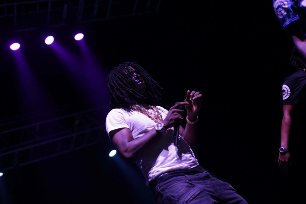 Chief Keef performing live at Fillmore Silver Spring with purple stage lights and gold chains Wallpaper