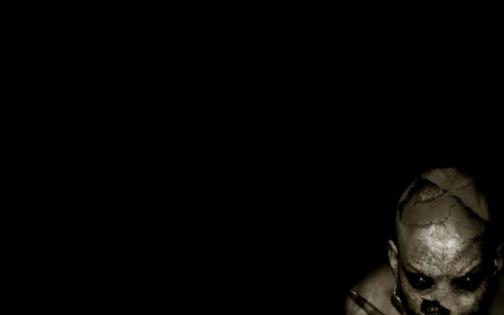 Chilling Shadows: A Menacing Creature Lurking in the Abyss Wallpaper