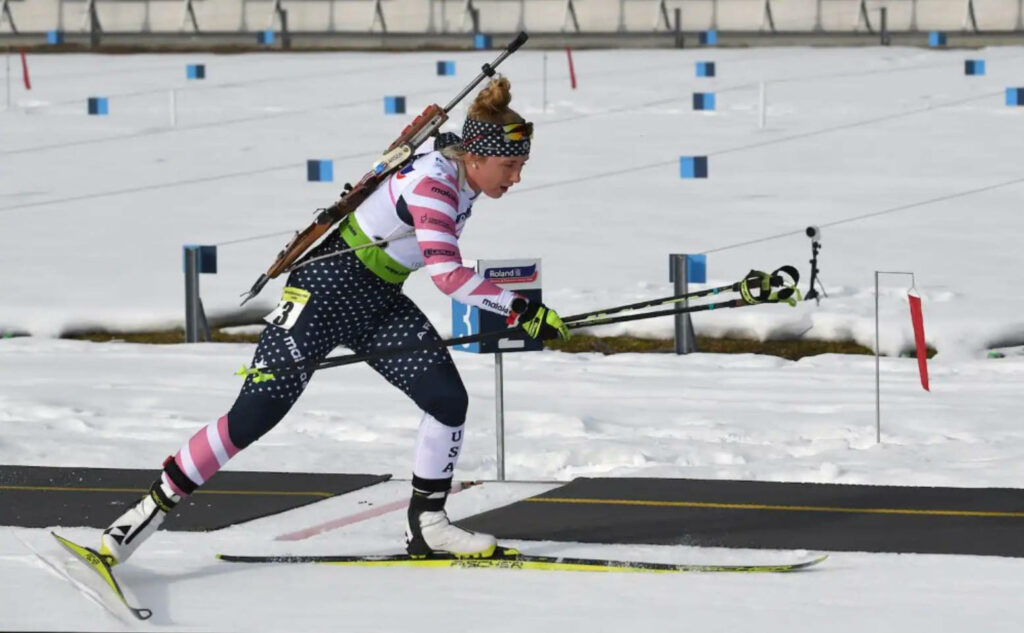Chloe Levins: Dynamic Biathlon Wallpaper on a Snowy Course