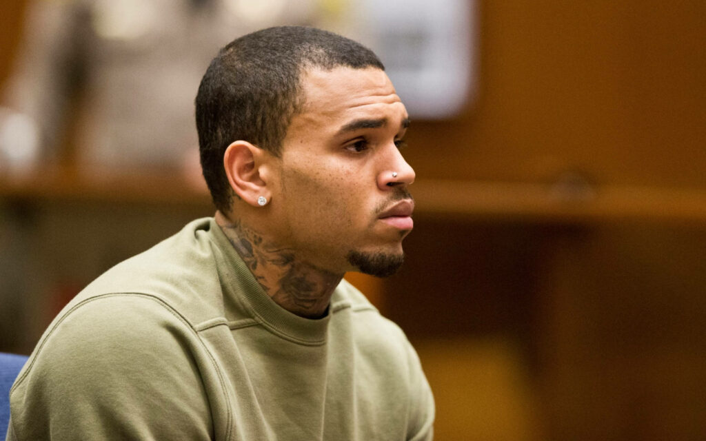 Chris Brown candid portrait showing deep focus and thoughtful expression wallpaper background
