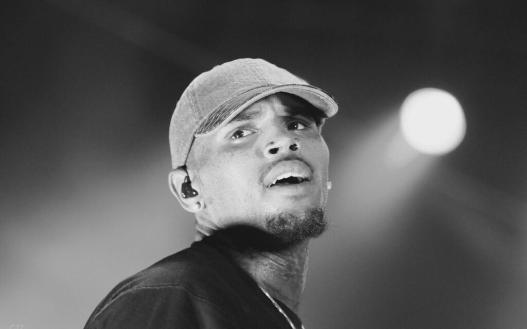 Chris Brown grayscale wallpaper candid on stage dynamic R&B artist expressive performance