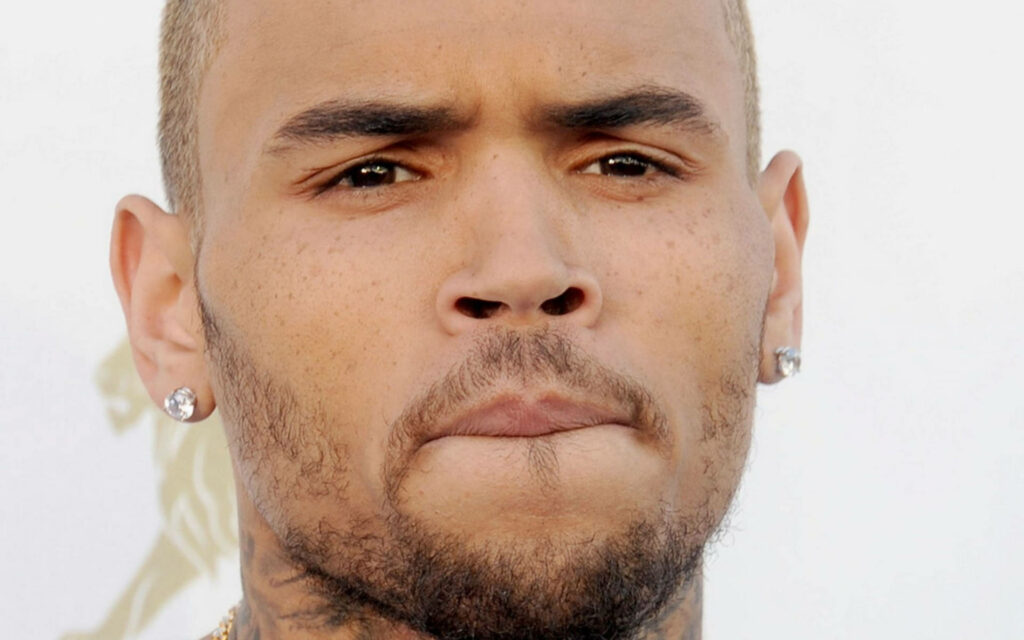 Close up of Chris Brown intense gaze detailed facial expression wallpaper background