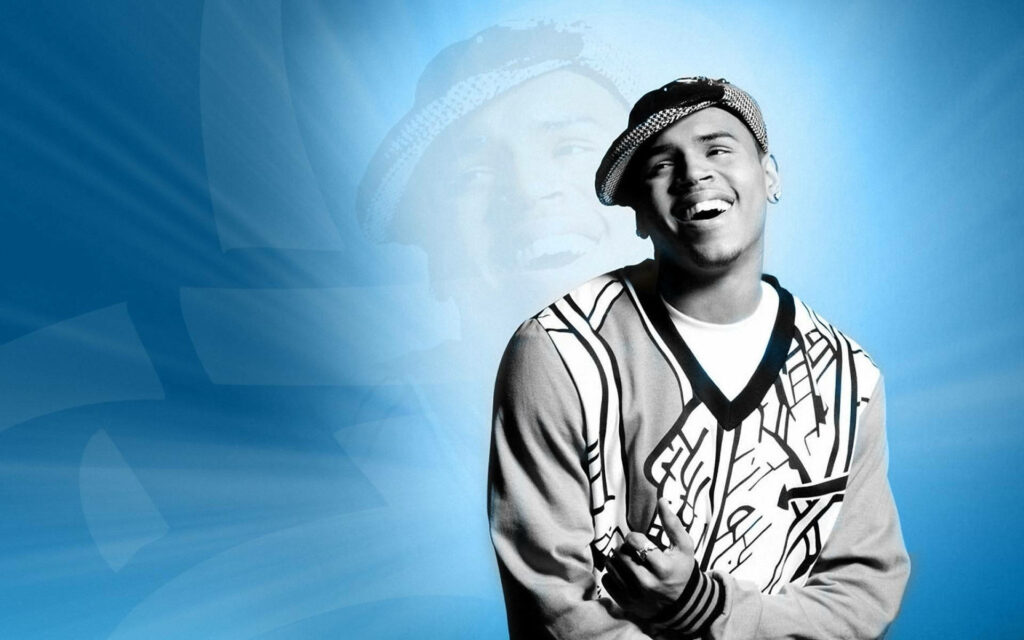 Chris Brown smiling confident digital wallpaper vibrant blue background abstract light effects