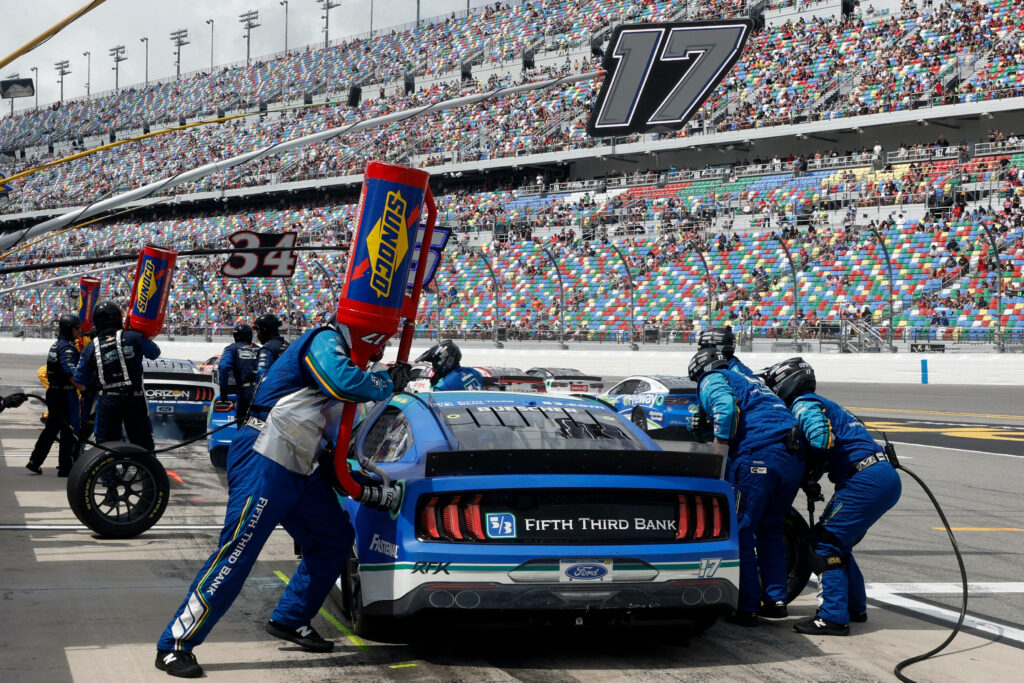 Chris Buescher Gas Up Wallpaper: Thrilling NASCAR Pit Stop Scene