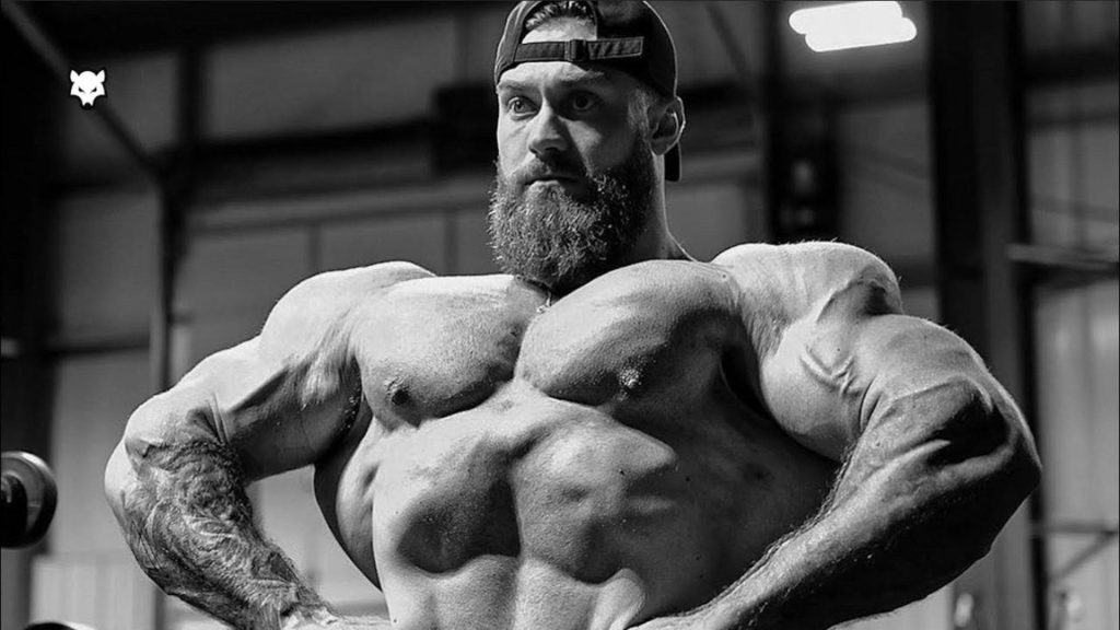 Chris Bumstead bodybuilding front lat spread grayscale wallpaper gym background intense physique