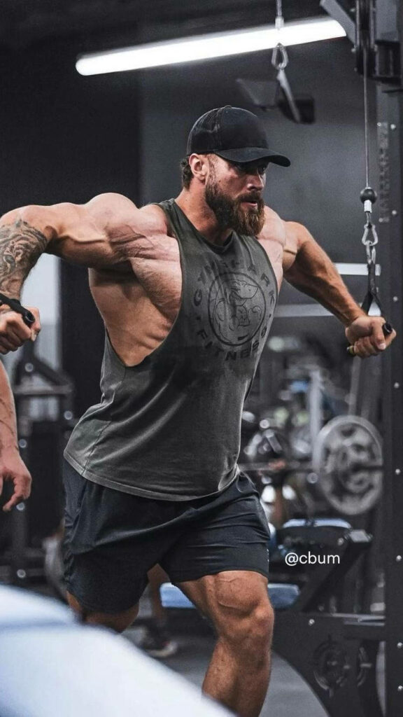 Chris Bumstead intense cable workout muscular physique modern gym fitness determination wallpaper