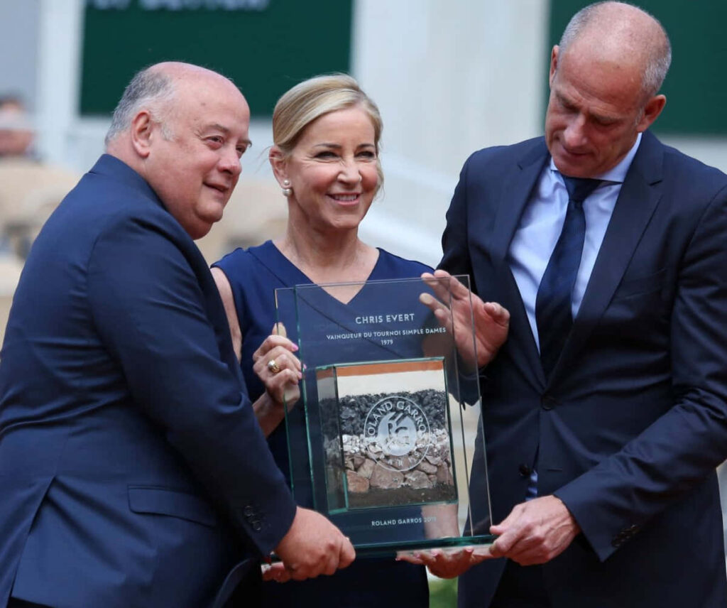 Chris Evert honored with Roland Garros plaque flanked by officials at tennis venue wallpaper background