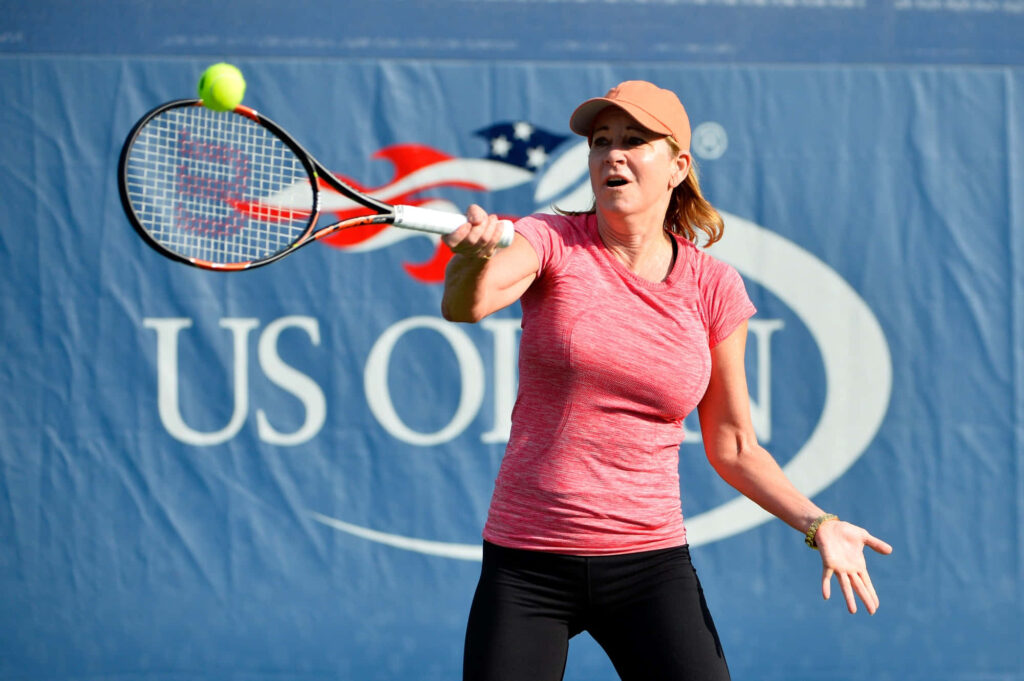 Chris Evert US Open tennis court backhand stroke focused athletic legendary player wallpaper
