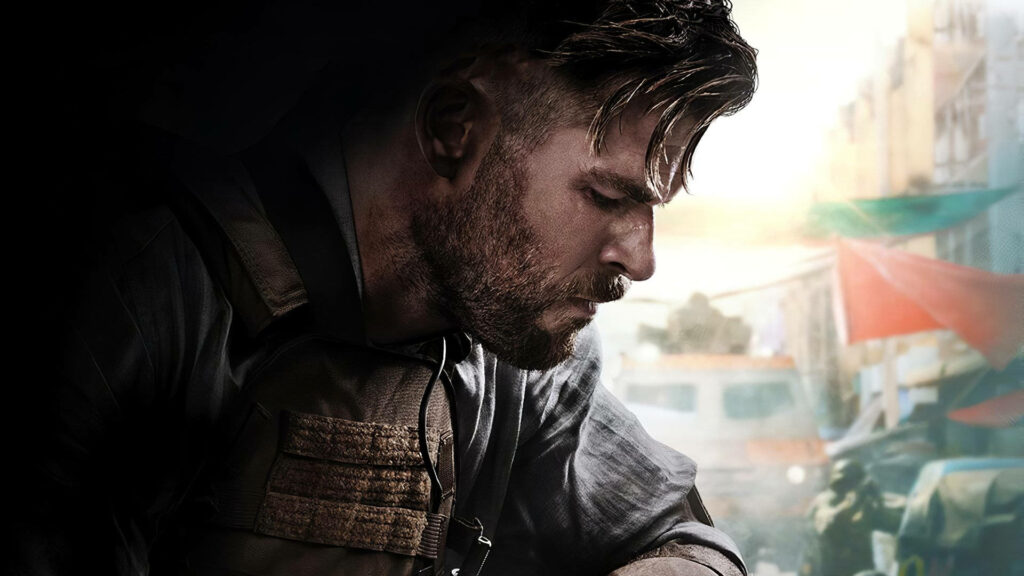 Chris Hemsworth in Extraction intense action scene gritty urban background wallpaper