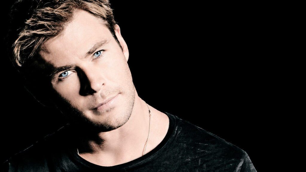 Chris Hemsworth as Thor intense gaze dark background Marvel superhero wallpaper background