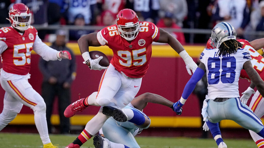 Dynamic Chris Jones Football Wallpaper: Intense Action Background
