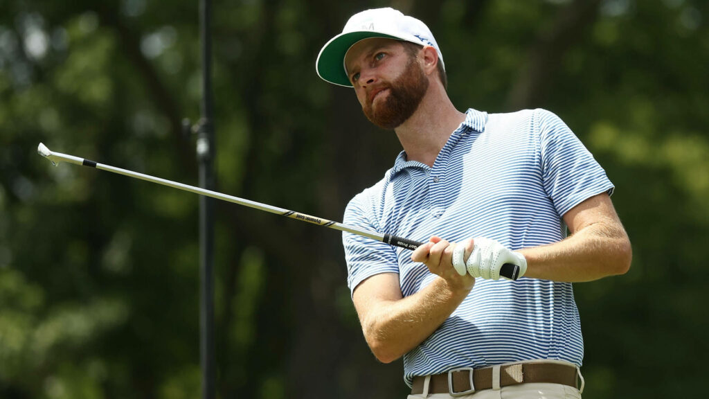 Chris Kirk golf swing focused athletic pose lush green background dynamic motion wallpaper