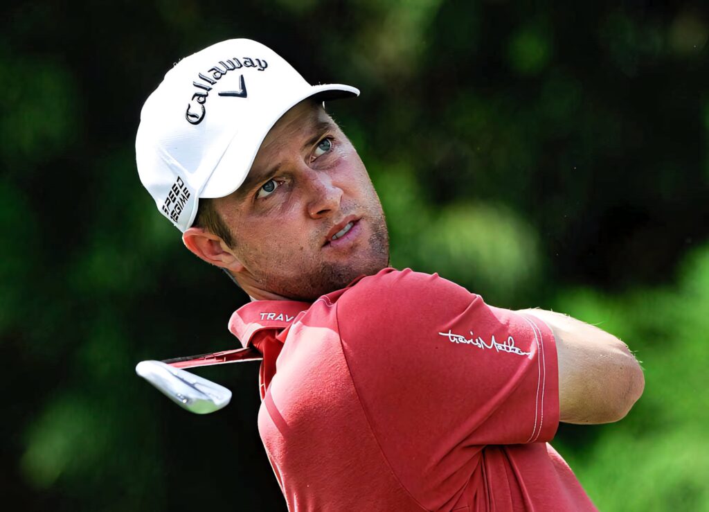 Chris Kirk golf swing intense focus vibrant green background competitive golf wallpaper
