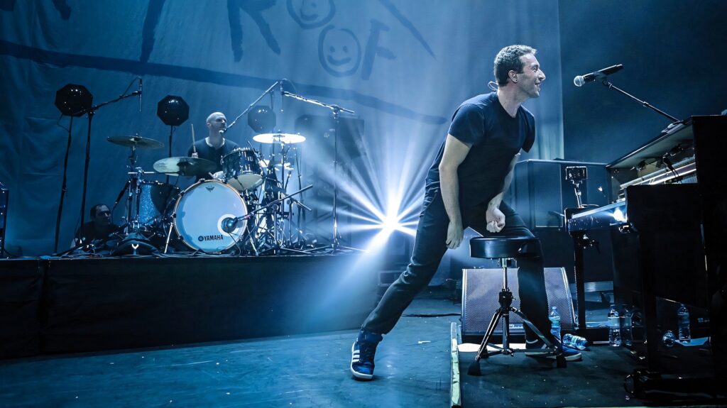 Chris Martin Coldplay performing live Ghost Stories 2014 concert blue stage lighting dramatic shadows Wallpaper