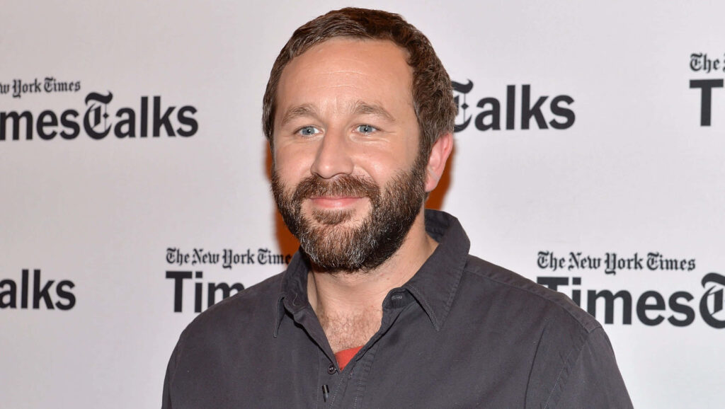 Chris O'Dowd smiling in casual dark shirt against TimesTalks backdrop friendly portrait wallpaper