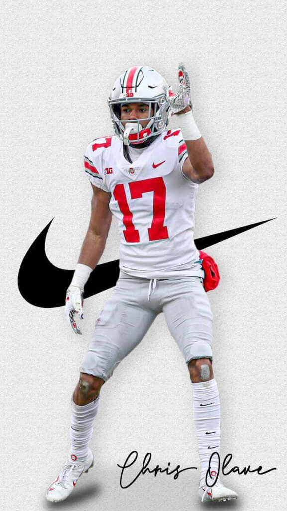 Chris Olave in white red football uniform dynamic action pose with Nike swoosh and autograph background Wallpaper