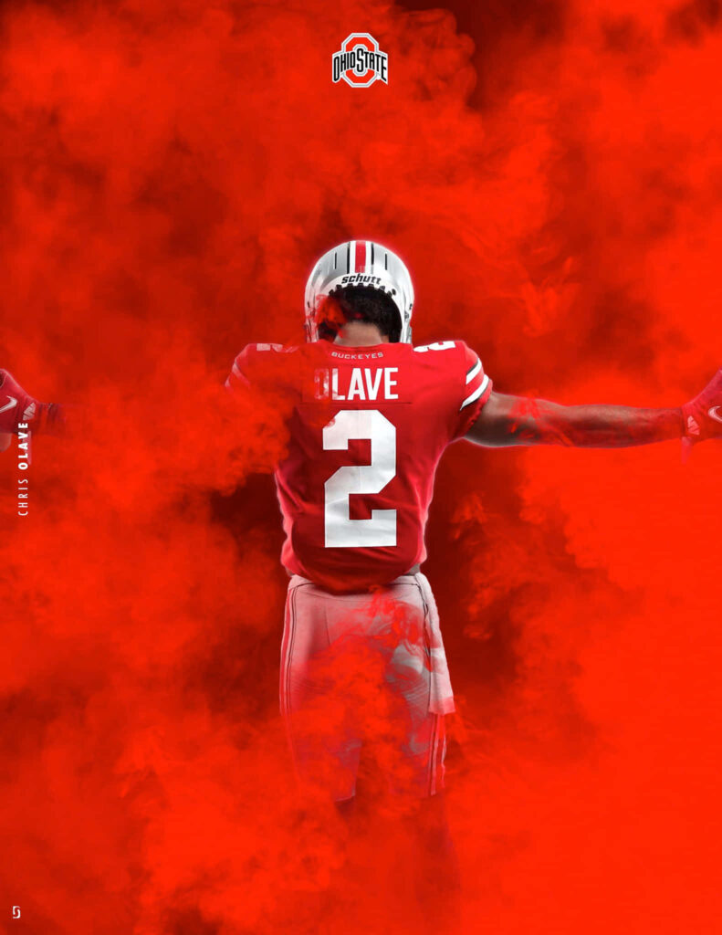 Chris Olave in Ohio State uniform number 2 with red smoke background dynamic sports wallpaper