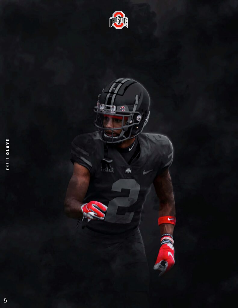 Chris Olave in Ohio State football uniform with smoky background and red gloves intense pose Wallpaper